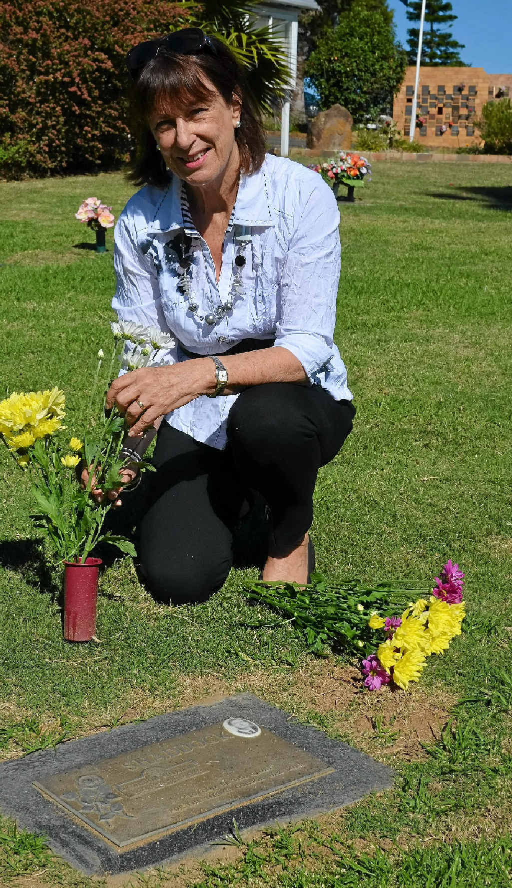 Daughter of Eden Gardens founder Gordon Shaddock, Margaret Hornsey, lays flowers by her father’s grave. Daughter of Eden Gardens founder Gordon Shaddock, Margaret Hornsey, lays flowers by her father’s grave.